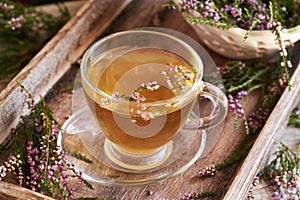 A cup of heather tea on a table
