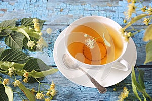 Cup of herbal tea with linden flowers