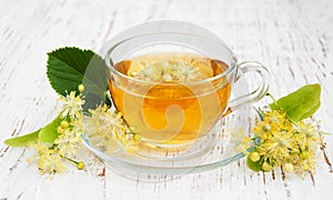 Cup of herbal tea with linden flowers