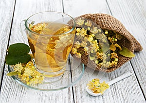 Cup of herbal tea with linden flowers