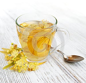 Cup of herbal tea with linden flowers