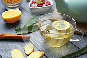 Cup of herbal tea on table