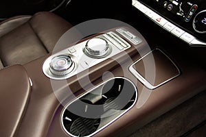 Cup holders inside modern car interior.