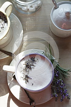 A cup of home made london fog tea latte drink with lavender flower buds, good morning concept, flat lay