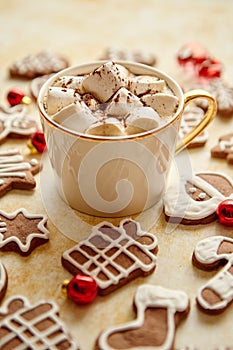 Cup of hot chocolate and Christmas shaped gingerbread cookies