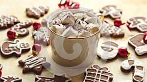 Cup of hot chocolate and Christmas shaped gingerbread cookies