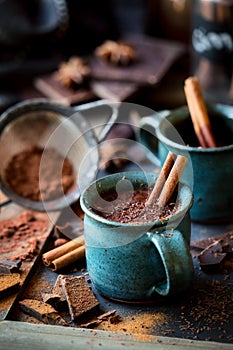 Cup of hot chocolate with a cinnamon stick