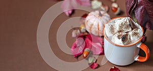 Cup of hot chocolate with marshmallow. Tasty Halloween food. Concept of cozy winter home environment. Autumn background.