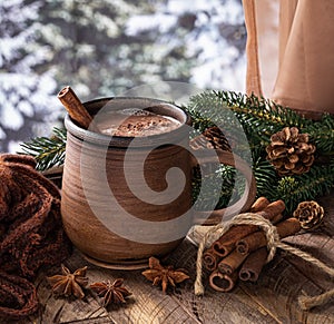 Cup of hot chocolate with winter background