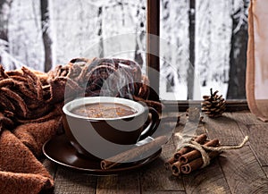 Cup of hot chocolate with winter background