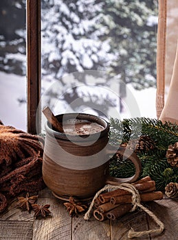 Cup of hot chocolate with winter background