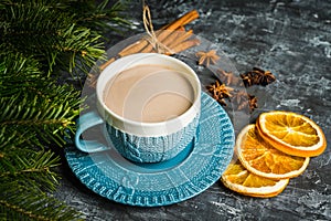 Cup of hot chocolate in winter decorations on the rustic background