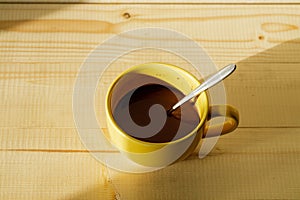 Cup of hot chocolate on wooden background