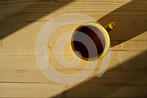 Cup of hot chocolate on wooden background