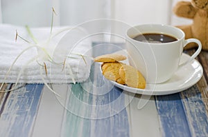 Cup of hot coffee and butter cookies.