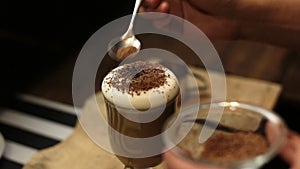 Cup of hot coffee with shaved chocolate and whipped cream