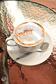 A cup of hot coofee on table