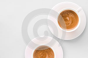 Cup of hot french coffee as breakfast drink, flatlay cups on white background