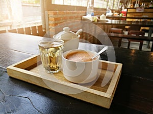 Cup of hot milk art coffee and tea in Thailand