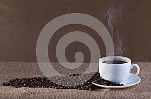 Cup of hot steaming coffee
