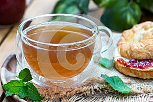 Cup of hot tea with mint leaves