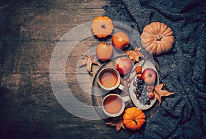 Cup of hot tea with pumpkins and autumn fruits. Happy Thanksgiving and Hello fall concept