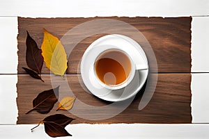 Cup of hot tea. On wooden table on white wooden table. Top view.