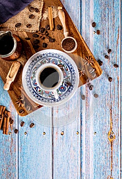 Cup of hot turkish coffee on a old vintage blue background