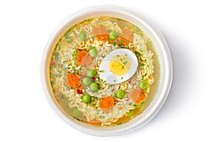 Cup of instant noodles with vegetables photo
