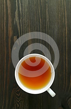 A Cup of Japanese Roasted Barley Tea or Mugicha Isolated on Wooden Table