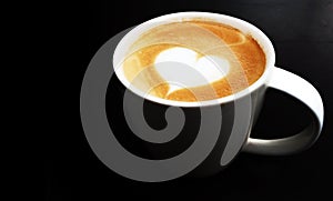 Cup of latte art coffee heart symbol