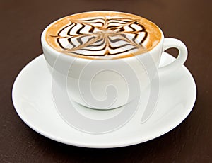 A cup of latte-art hot coffee photo