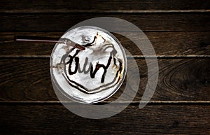 Cup of latte coffee on old wood table Background, Latte coffee on old wooden Background table