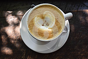 The cup of lovely cappuccino in the morning light