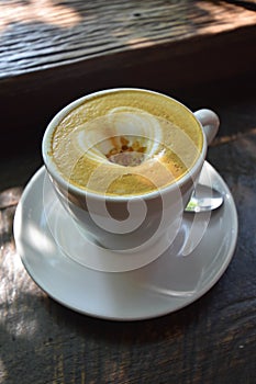 The cup of lovely cappuccino in the morning light