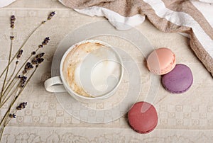 Cup with macaroons and dry lavender