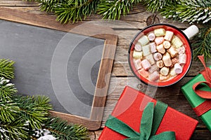 Cup with marshmallow and xmas gift boxes