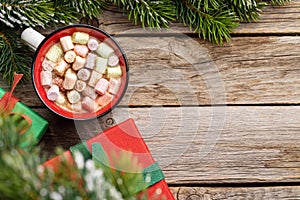 Cup with marshmallow and xmas gift boxes