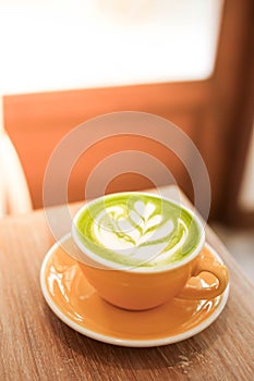 Cup of Matcha green tea latte in cafe