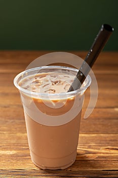 cup of milktea with tapiocas at vertical composition