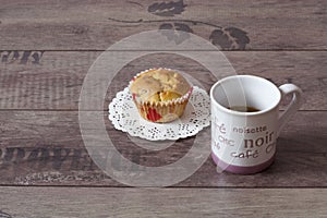 A cup of offee and muffin