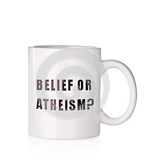 Cup with phrase Belief Or Atheism? on white background