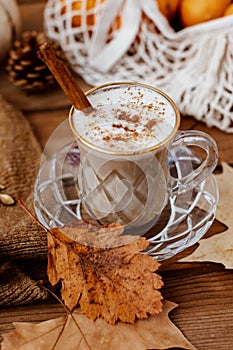 Cup of Pumpkin Spice Latte and Fall Decor from fresh  pumpkins.
