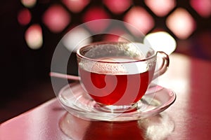 Cup of red tea shallow depth of field