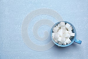 Cup with refined sugar cubes