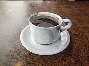 a cup of robusta coffee on the table