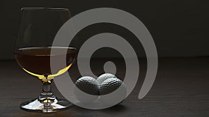 CUP OF RUM WITH GOLF BALLS ON HIGH CONTRAST