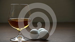 CUP OF RUM WITH GOLF BALLS ON HIGH CONTRAST