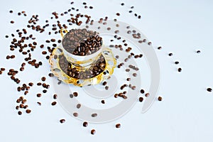 Cup and saucer with coffee beans