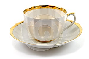 Cup and saucer with gold trim